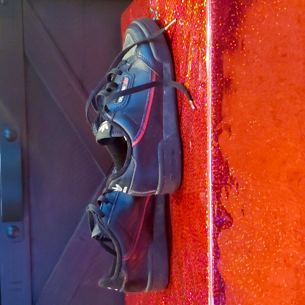 Boys Adidas sneakers. Lightly worn. Black with red strip.